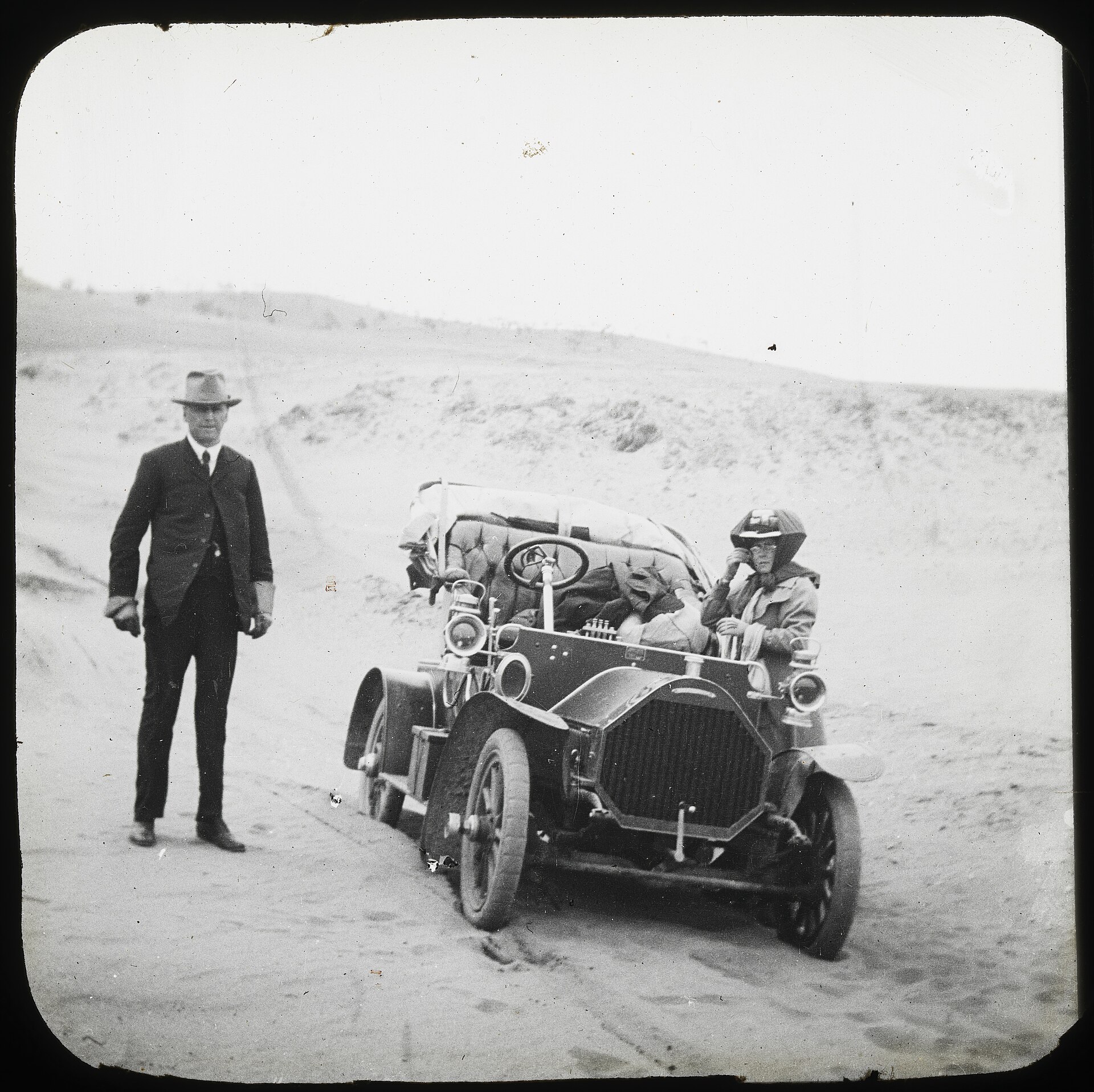 A man and woman with an early car, Kosciuszko National Park, New South Wales, 1914-16
